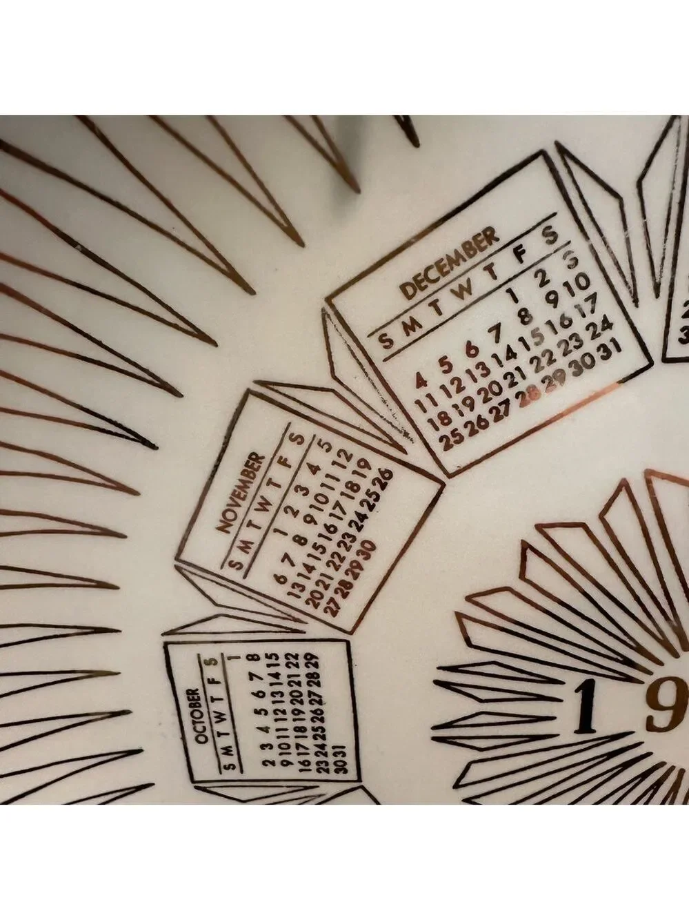 Vintage 1960 Calendar plate. Excellent shape. Wall hanger included. White + Gold